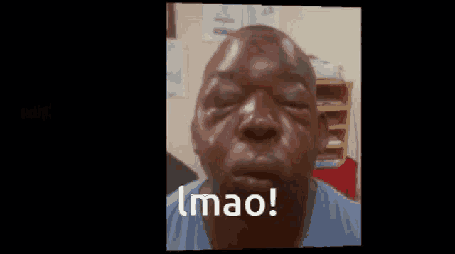 a close up of a man 's face with the word imao written on it