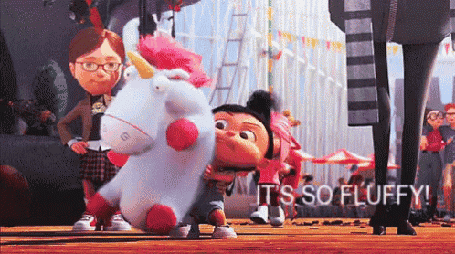 a girl is hugging a stuffed unicorn with the words " it 's so fluffy " written on the bottom