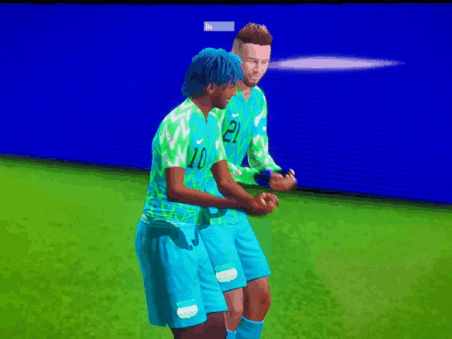 two soccer players wearing blue and green uniforms with the number 10 on the front