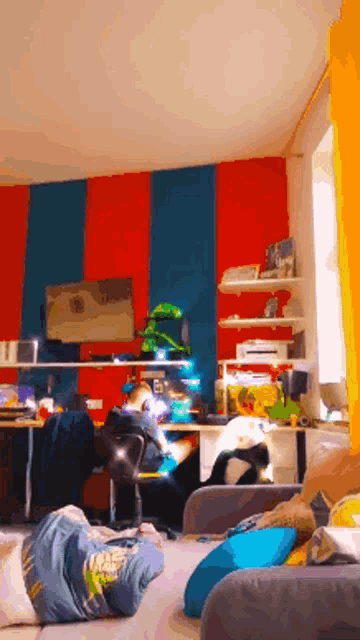 a person laying on a couch in front of a desk with a sign that says ' a ' on it