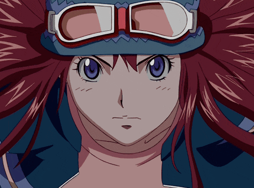 a close up of a girl with red hair wearing a hat and goggles