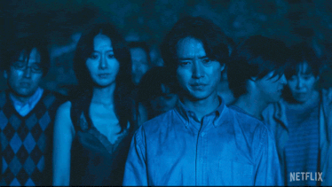 a group of people standing in a dark room with the words there 's no running from the games netflix