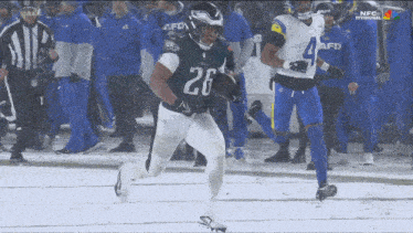 a football player with the number 26 on his uniform