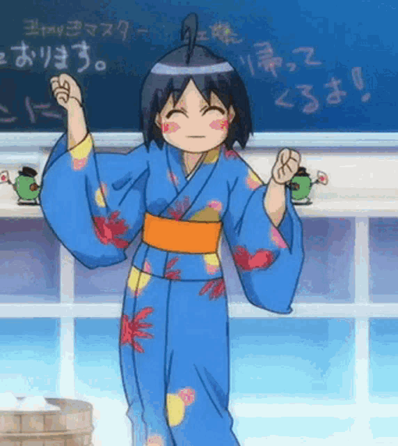 a girl in a blue kimono is standing in front of a blackboard with chinese writing