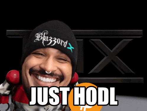 a man wearing a beanie that says blazord x