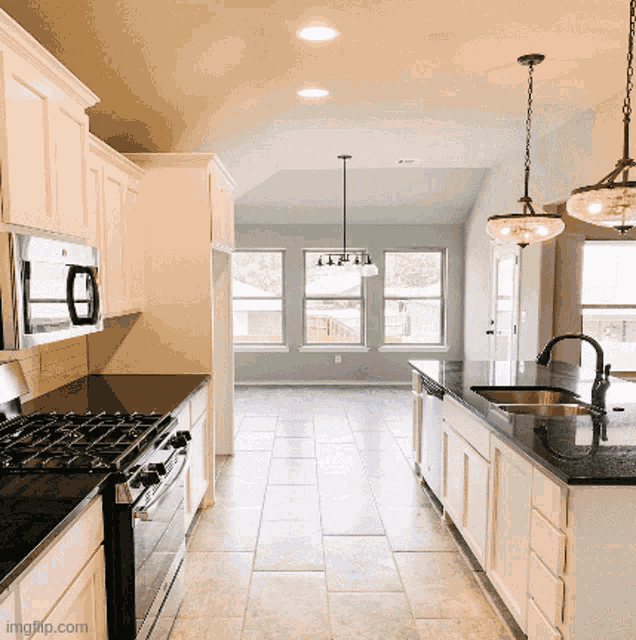 a kitchen with a stove top oven and a sink with the website imgflip.com on the bottom right