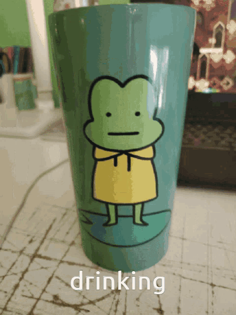 a drinking cup with a frog on it
