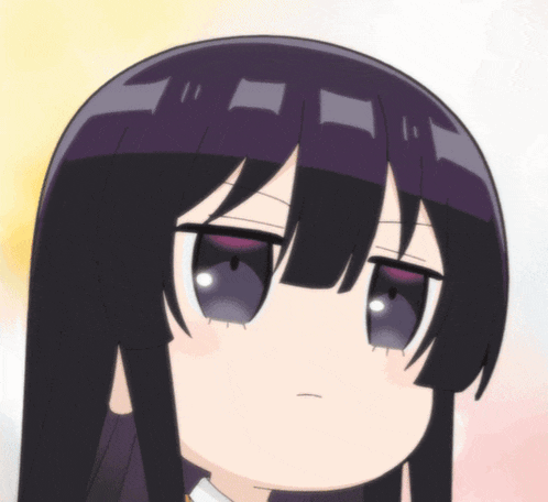 a close up of a girl 's face with long black hair
