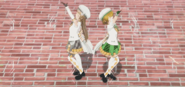 a couple of anime girls standing next to each other on a stage