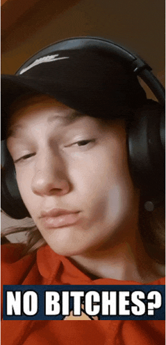 a person wearing headphones and a hat with the words no bitches written on the bottom