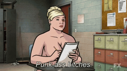a naked woman is sitting at a desk and says punk ass bitches