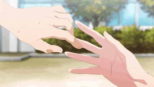a person 's hand is reaching out to touch another person 's hand