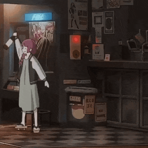 a girl in a green dress is dancing in a dark room with her arms outstretched .