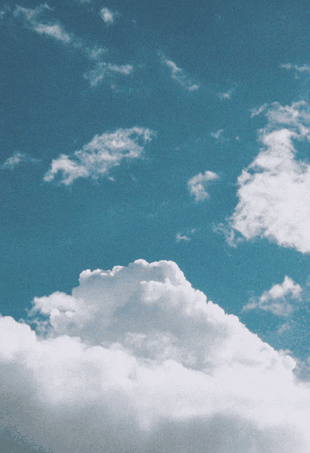 a cloudy blue sky with a few white clouds