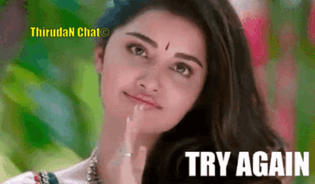 a woman with a bindi on her forehead and the words try again
