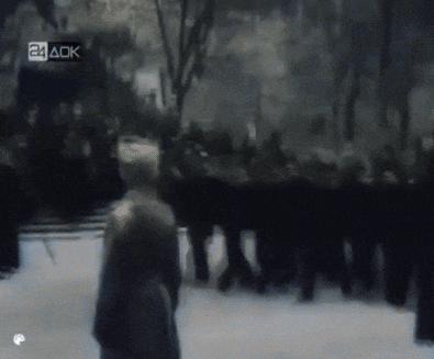 a blurry picture of a crowd with the letters 24 ack on the bottom left