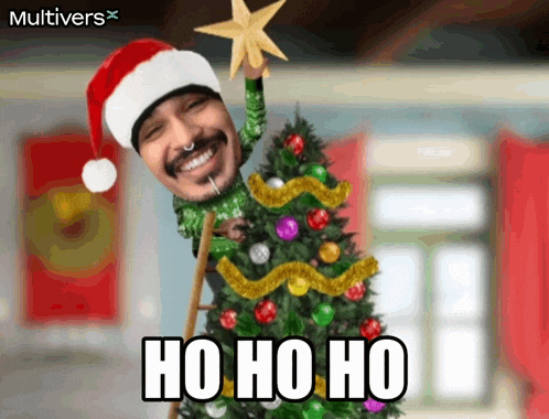a man in a santa hat holds a star on top of a christmas tree