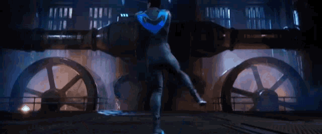 a man in a blue suit is flying through the air