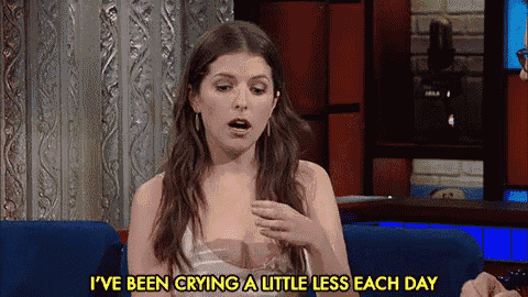 a woman is crying a little less each day while sitting in a chair on a show .