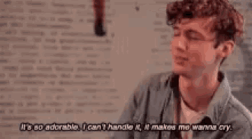 a young man is crying and says it 's so adorable i can 't handle it it makes me wanna cry