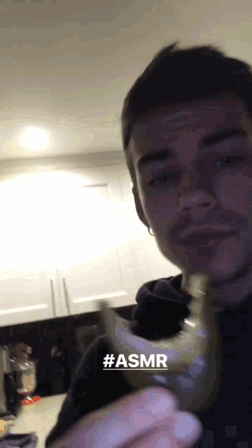 a man eating a banana with the hashtag #asmr on the bottom right