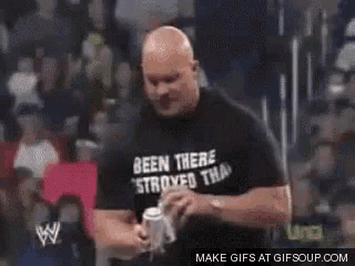 a man in a black shirt is being punched in the face by a woman .