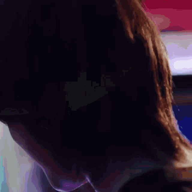 a close up of a person 's face with a blurred background