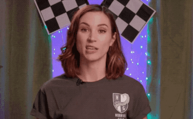 a woman says you 're in trouble while wearing a checkered headband