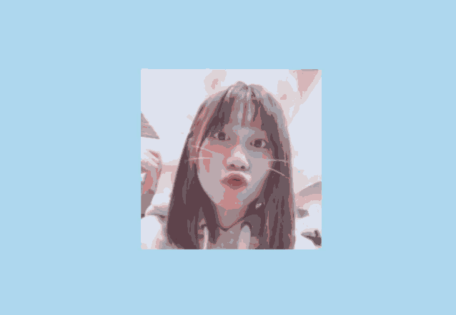 a girl wearing a cat ear headband looks at the camera on a blue background