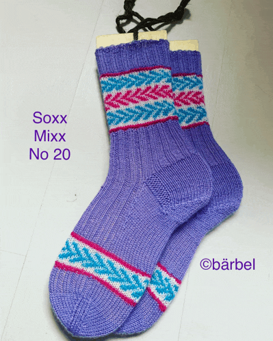 a pair of purple soxx mixx no 20 socks on a white surface