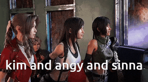 a group of women are standing next to each other in a room looking at a screen .