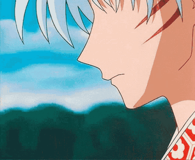 a close up of a person 's face with a blue sky behind them