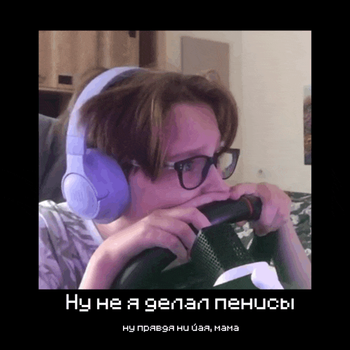 a man wearing headphones and glasses holds a microphone