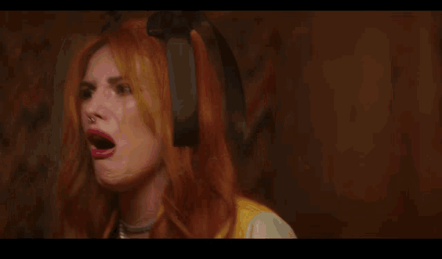 a woman in a yellow and white jacket is saying it 's all gonna get fucked up again