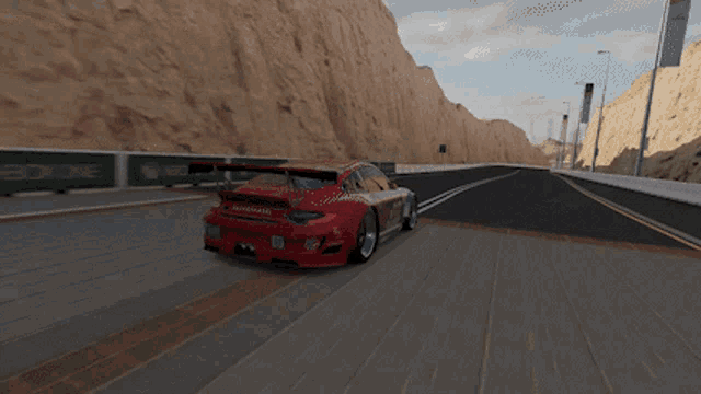 a red sports car is driving down a road in front of a green xboxone banner