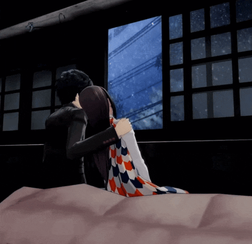 a man and a woman are hugging in front of a window