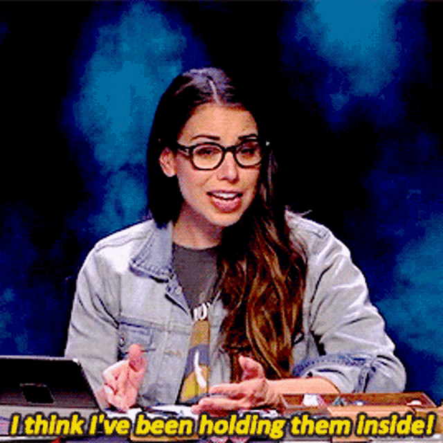 a woman wearing glasses and a denim jacket says i think i ve been holding them inside