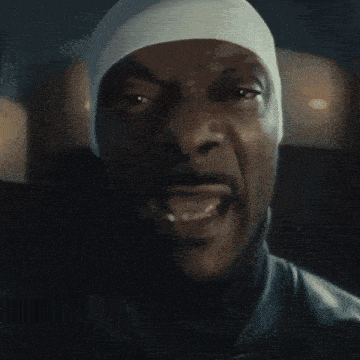 a close up of a man with his mouth open