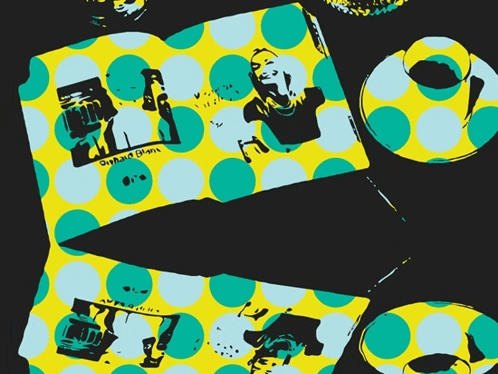 a yellow and blue polka dot pattern on a black background with the letters a and b
