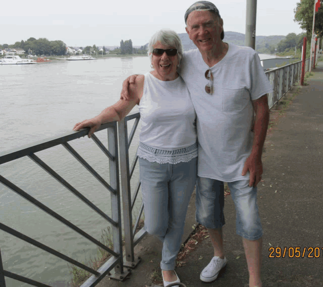 a man and woman posing for a picture with the date 29/05/20