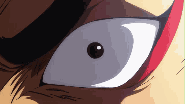 a close up of a cartoon character 's eye with a red stripe