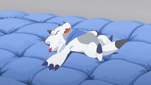 a cartoon character laying on a blue blanket with its eyes closed