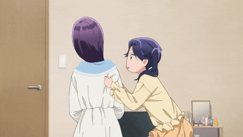 two anime girls are standing next to each other in a bedroom