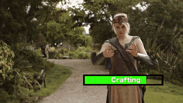 a woman in a viking costume is standing on a path with the word crafting on it