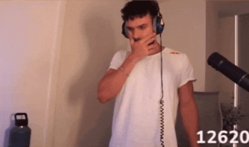 a man wearing headphones with the number 12620 on the bottom right