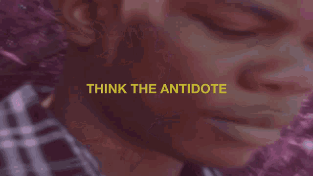 a close up of a person 's face with the words think the antidote in yellow letters