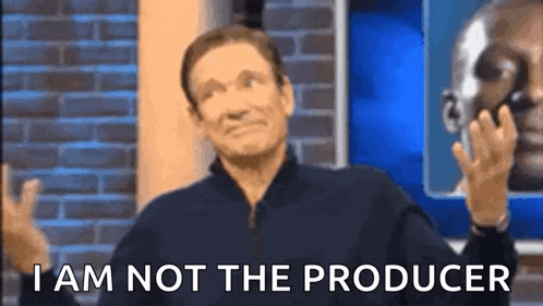 a man is saying i am not the producer in front of a brick wall .