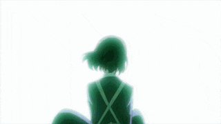 a girl with a green x on her back is sitting in front of a blue and white background