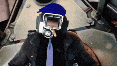 a man wearing a gas mask and a hat has a clock on his wrist