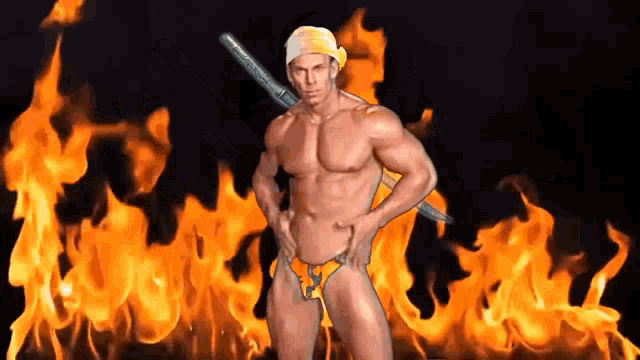 a shirtless man holding a sword stands in front of flames